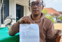 Korban dugaan pengeroyokan di kawasan Pasar Rau, Kota Serang, memperlihatkan dokumen laporan Dok : ( Ist/Total Banten)